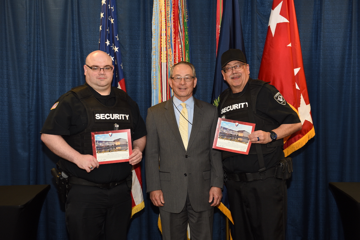 Security Officers Michael Draa and Robert Batten were recognized by AMC Provost Marshall George Milan